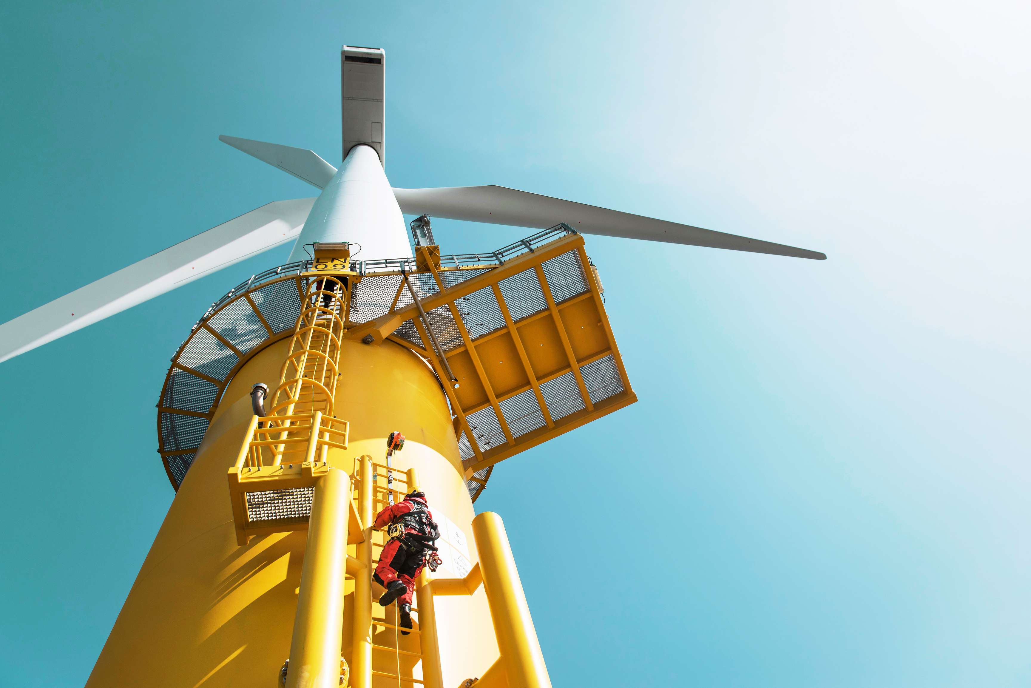 Rosenxt Engineers climbing wind turbine from boat at offshore windfarm