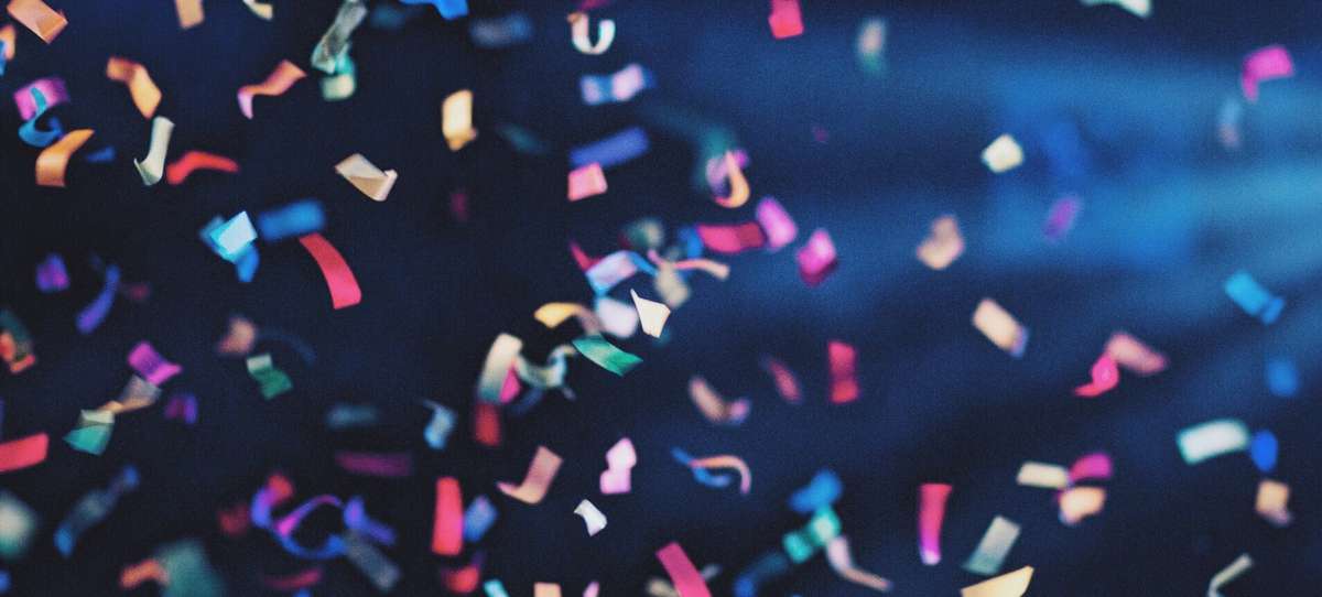 Dark blue background with confetti
