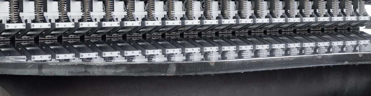 Close-up view inside our plate inspection system where you can see how the probes check the steel plate.